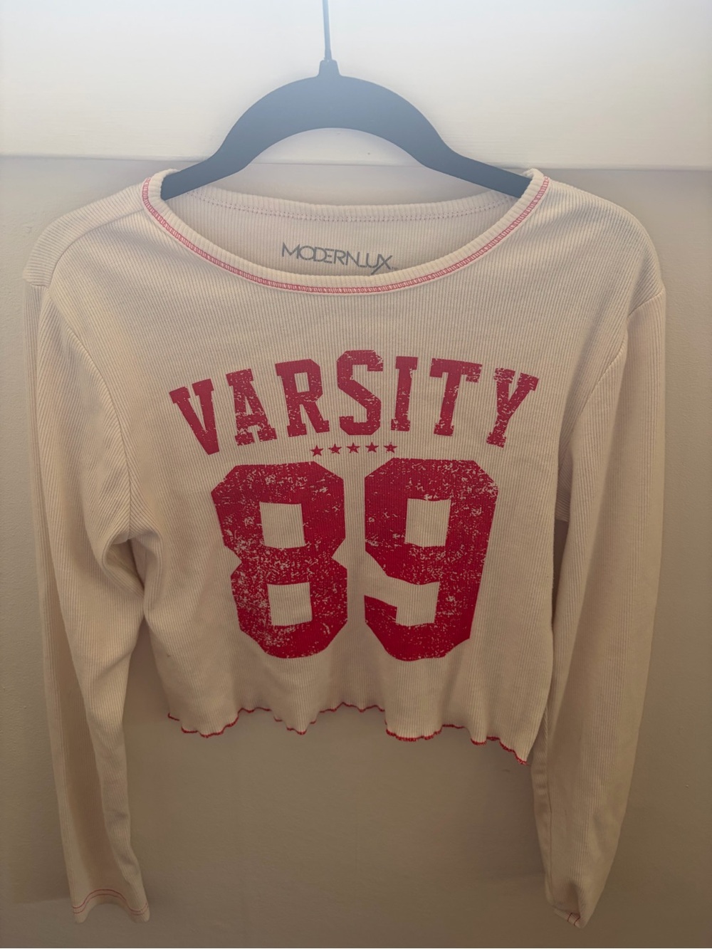 Cream & red varsity long sleeve shirt with red 'VARSITY 89' graphic, size XS.